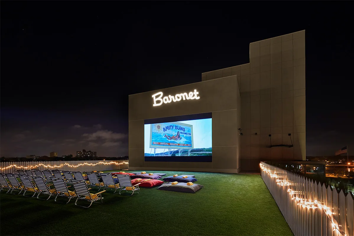 Baronet open air cinema with outdoor seating and movie screen at night near SURFHOUSE Asbury Park