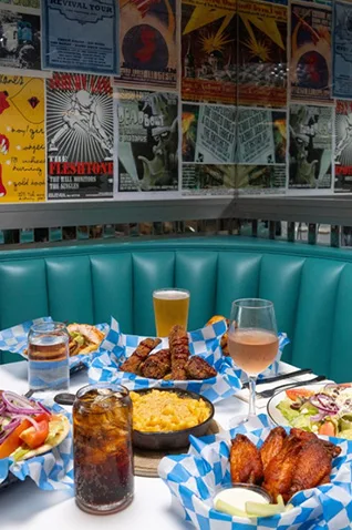 Things to do in Asbury Park NJ: Enjoy food and drinks at a local restaurant with music posters
