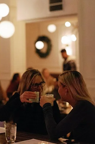 Friends toasting at a restaurant in Asbury Park NJ