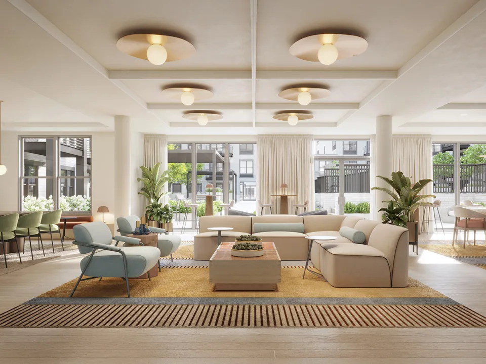 Indoor lounge at SURFHOUSE Asbury Park Apartments with modern lighting and comfortable seating