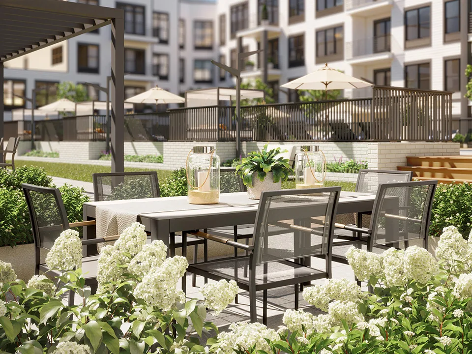 SURFHOUSE Apartments Asbury Park outdoor dining area surrounded by white flowers